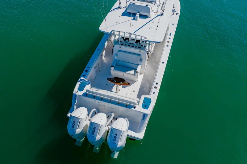  Yacht Photos Pics Aerial view of 2025 SeaVee 370Z boat with triple outboard engines on clear water.