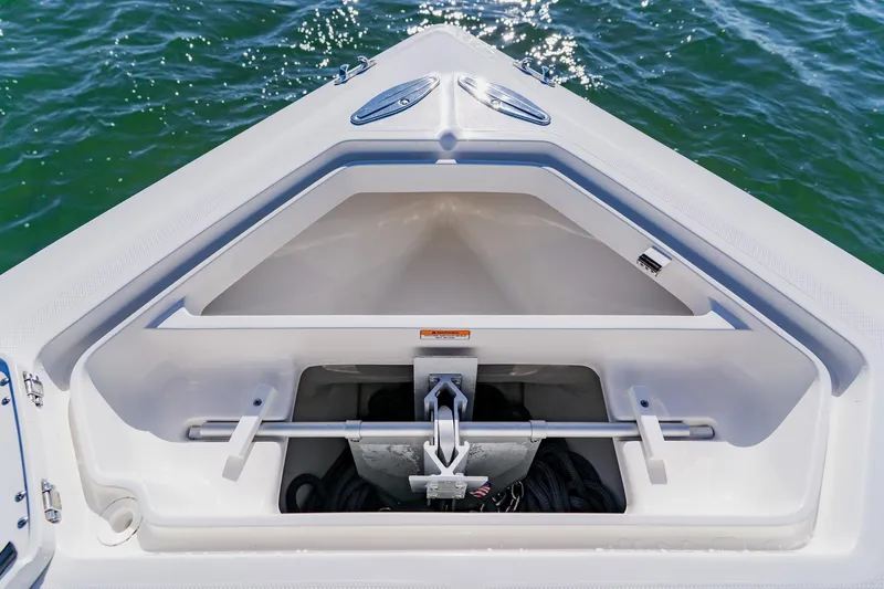  Yacht Photos Pics Bow storage compartment of 2025 SeaVee 370Z boat, open on calm water.