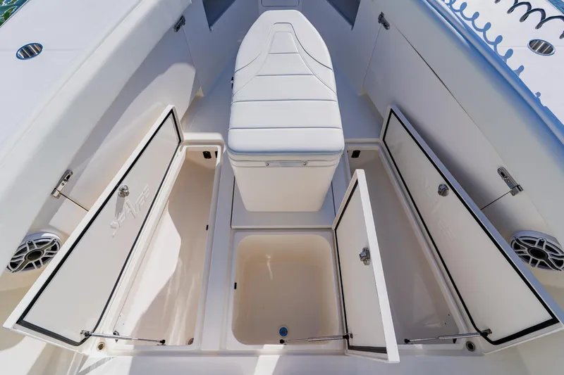  Yacht Photos Pics 2025 SeaVee 370Z boat interior with open storage compartments and cushioned seating.