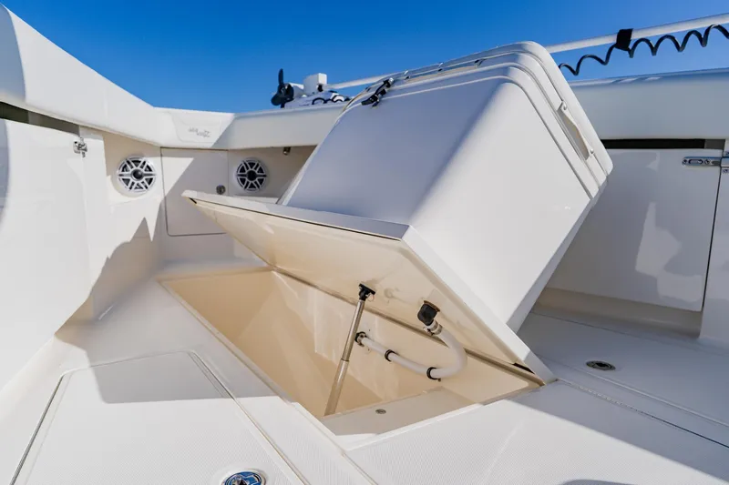  Yacht Photos Pics 2025 SeaVee 370Z boat storage compartment with open hatch, showcasing sleek design and functionality.