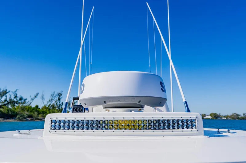  Yacht Photos Pics 2025 SeaVee 370Z boat with radar and LED lights, clear blue sky background.
