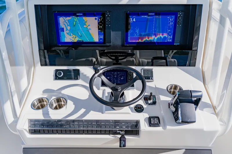  Yacht Photos Pics 2025 SeaVee 370Z boat dashboard with navigation screens and controls.