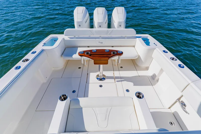  Yacht Photos Pics 2025 SeaVee 370Z boat deck with triple engines and sleek seating on water.