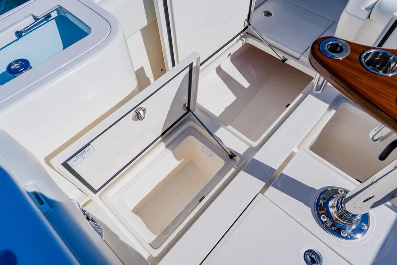  Yacht Photos Pics 2025 SeaVee 370Z boat storage compartments and seating area, featuring sleek design and functionality.