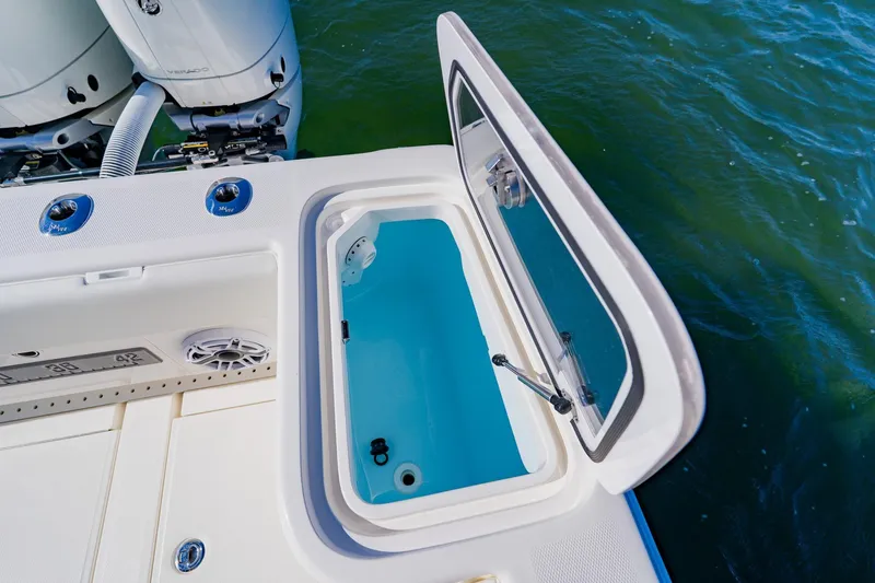  Yacht Photos Pics 2025 SeaVee 370Z boat with open storage compartment, near outboard motors.