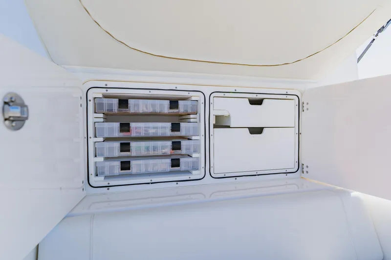  Yacht Photos Pics Storage compartments on a 2025 SeaVee 370Z boat, featuring organized tackle boxes and drawers.