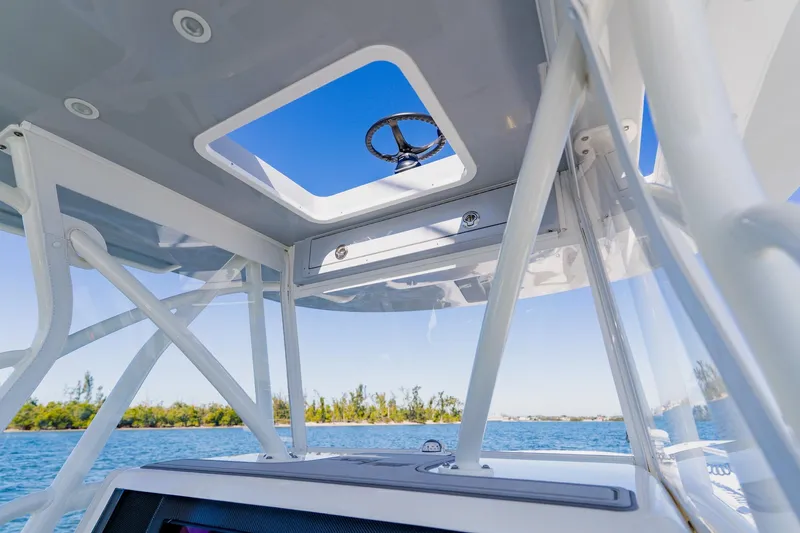  Yacht Photos Pics Interior view of 2025 SeaVee 370Z boat, showcasing helm and open sky hatch.