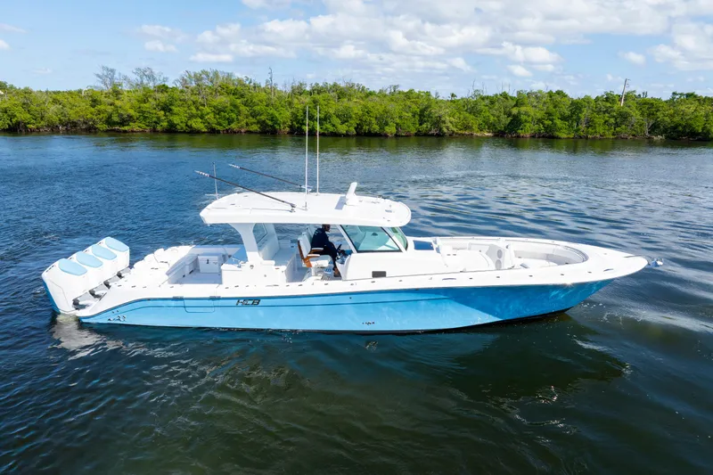  Yacht Photos Pics 2026 HCB 48 Campeon boat on calm water, featuring sleek design and triple engines.