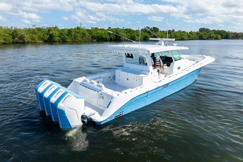  Yacht Photos Pics 2026 HCB 48 Campeon boat on water, featuring sleek design and multiple outboard engines.