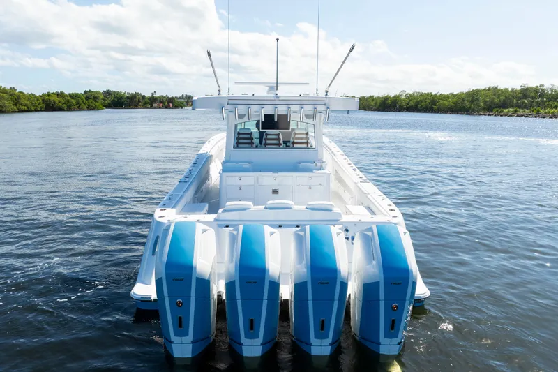  Yacht Photos Pics 2026 HCB 48 Campeon boat with four powerful outboard engines on a calm waterway.