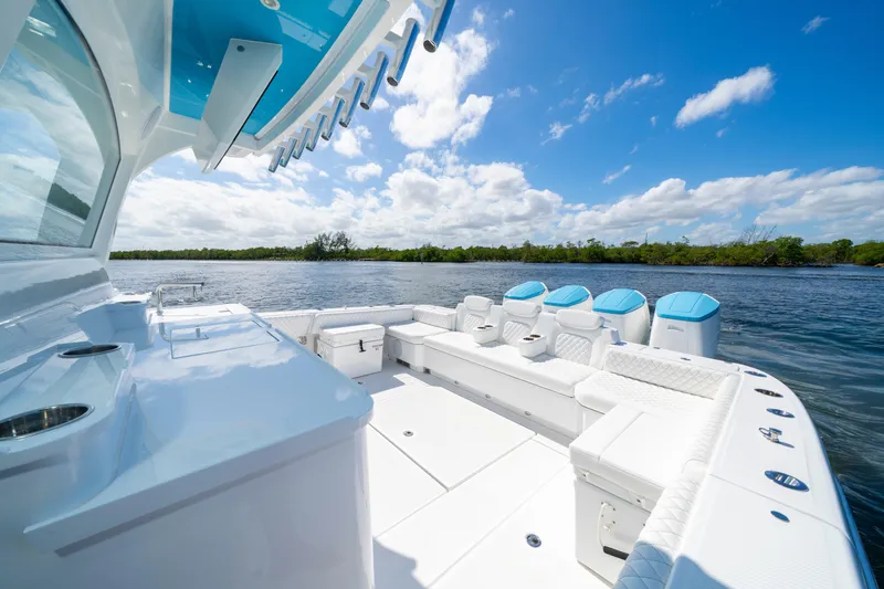  Yacht Photos Pics 2026 HCB 48 Campeon boat with luxurious seating on a sunny day.