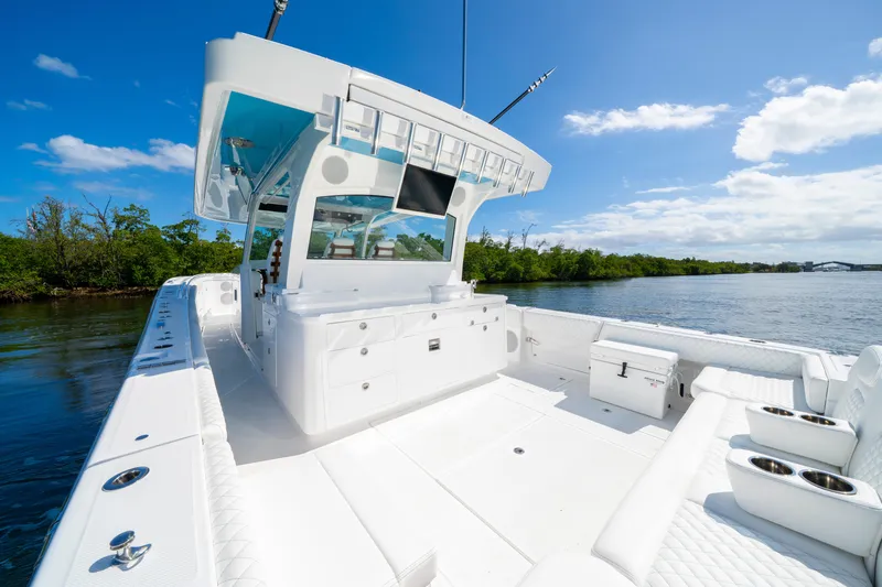  Yacht Photos Pics 2026 HCB 48 Campeon boat with sleek white deck, cruising on a sunny day.