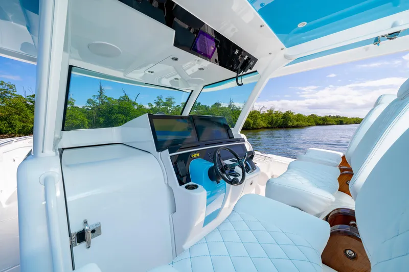  Yacht Photos Pics 2026 HCB 48 Campeon boat interior with modern helm and luxurious seating.