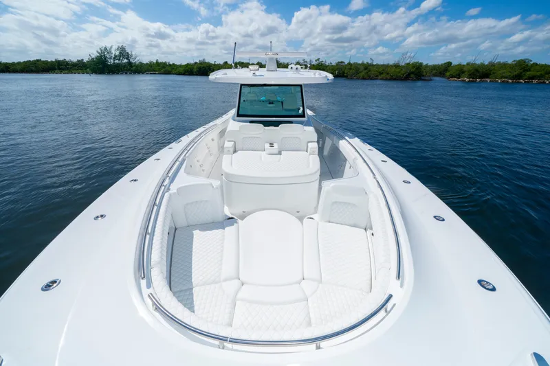  Yacht Photos Pics 2026 HCB 48 Campeon boat with luxurious white seating on calm water.