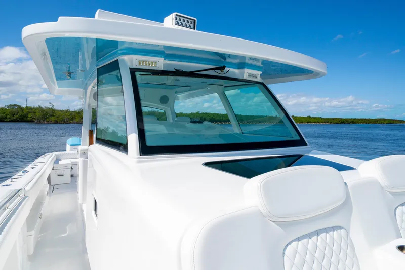  Yacht Photos Pics 2026 HCB 48 Campeon boat on water, featuring sleek design and modern cockpit.