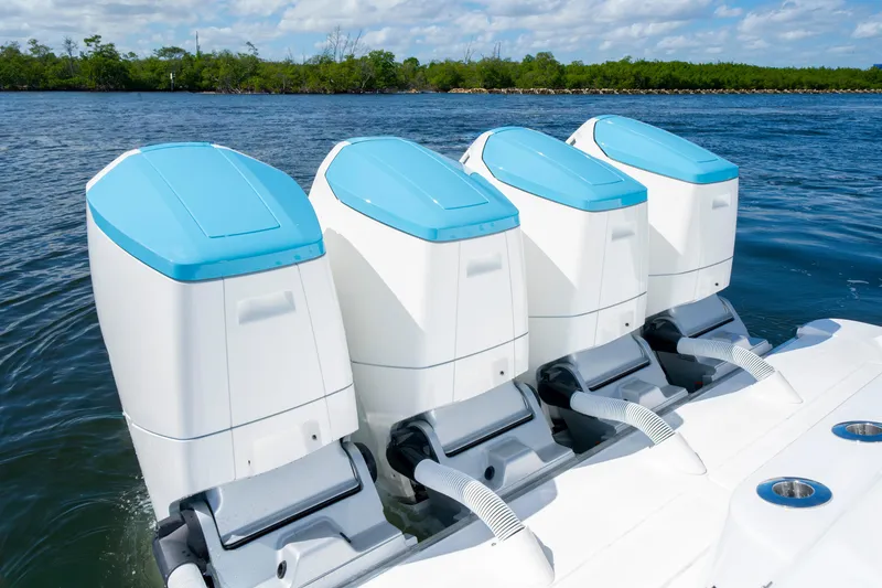  Yacht Photos Pics 2026 HCB 48 Campeon boat with four powerful outboard engines on water.