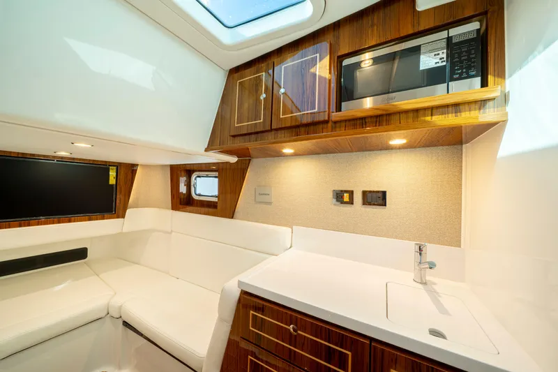  Yacht Photos Pics Luxurious interior of 2026 HCB 48 Campeon yacht with modern kitchen amenities.
