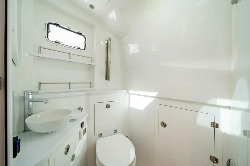  Yacht Photos Pics Luxurious bathroom interior of 2026 HCB 48 Campeon boat, featuring modern fixtures and sleek design.