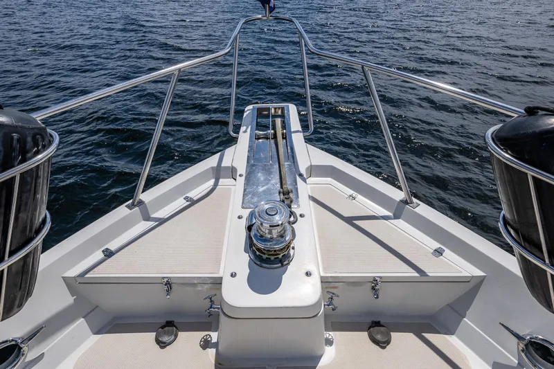 Am&eacute;lie Yacht Photos Pics Bow view of 1997 Offshore Yachts 52 Sedan on open water.