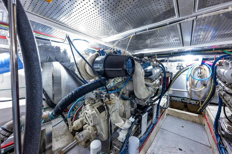 Am&eacute;lie Yacht Photos Pics Engine room of 1997 Offshore Yachts 52 Sedan, showcasing complex machinery and wiring.