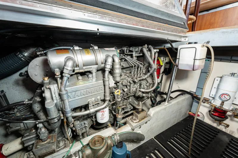  Yacht Photos Pics Engine room of a 2005 Mainship 400 Trawler, featuring a Yanmar engine.