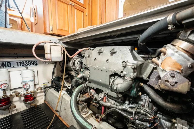  Yacht Photos Pics Engine room of a 2005 Mainship 400 Trawler, showcasing mechanical components and systems.