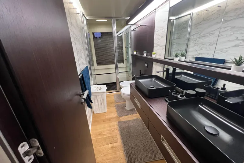 Rus&egrave; Yacht Photos Pics Luxurious bathroom in 2006 Azimut 86 Sport yacht with modern fixtures and elegant design.