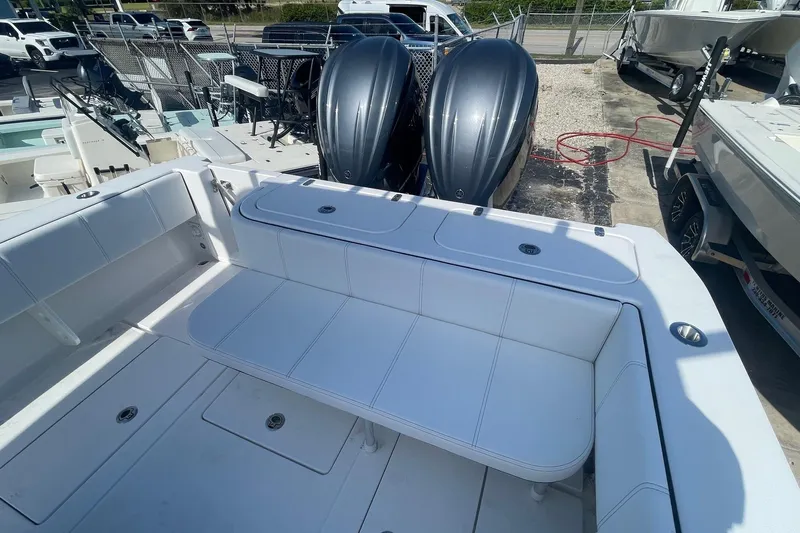  Yacht Photos Pics 2026 Contender 32 ST boat with dual engines and spacious seating area.