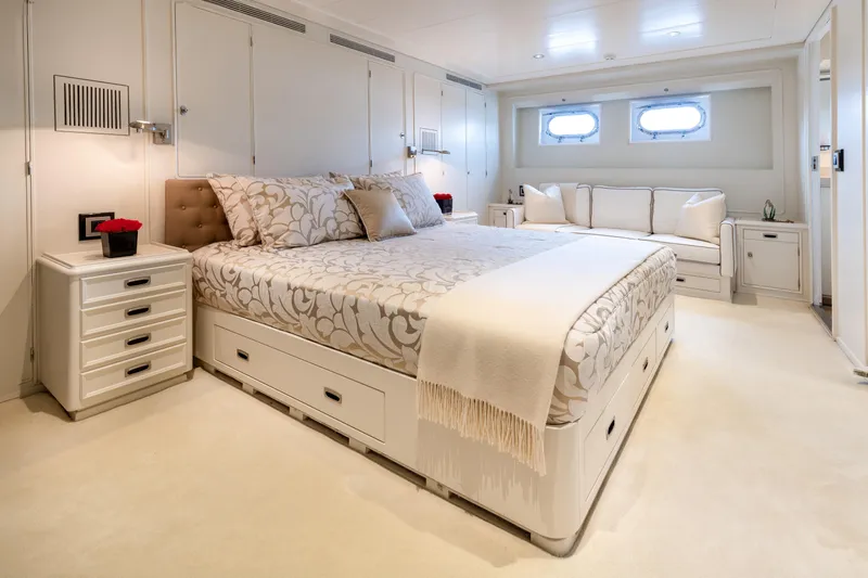 Anonymous Yacht Photos Pics Luxurious yacht bedroom with elegant decor, featuring a comfortable bed and stylish furnishings, 1981 Hellenic Shipyards.