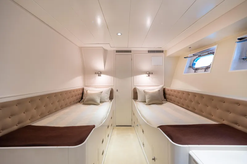 Anonymous Yacht Photos Pics Luxurious twin cabin interior on 1981 Hellenic Shipyards custom yacht, featuring elegant design.