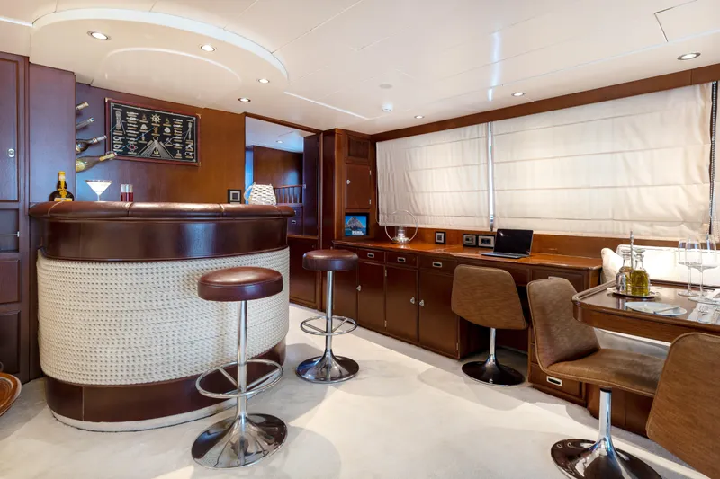 Anonymous Yacht Photos Pics Luxurious yacht interior with bar and dining area, Hellenic Shipyards Custom, 1981 model.