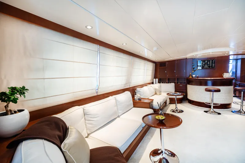 Anonymous Yacht Photos Pics Luxurious yacht interior with elegant seating and bar, Hellenic Shipyards Custom, 1981 model.
