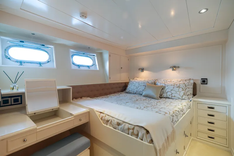 Anonymous Yacht Photos Pics Luxurious yacht bedroom with elegant decor, featuring a comfortable bed and stylish furnishings, Hellenic Shipyards 1981.