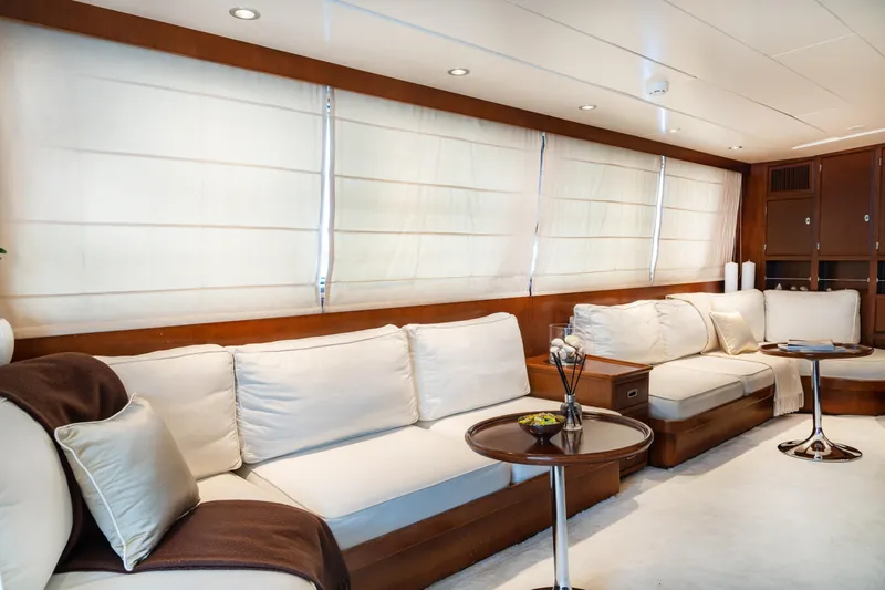 Anonymous Yacht Photos Pics Luxurious yacht interior with white sofas, wooden accents, and modern decor, Hellenic Shipyards Custom 1981.