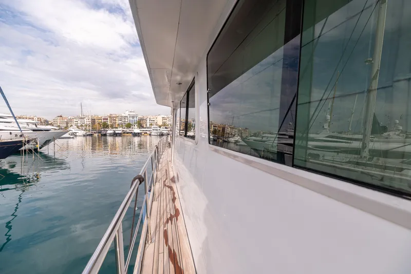Anonymous Yacht Photos Pics Side view of 1981 Hellenic Shipyards custom yacht docked in a marina.