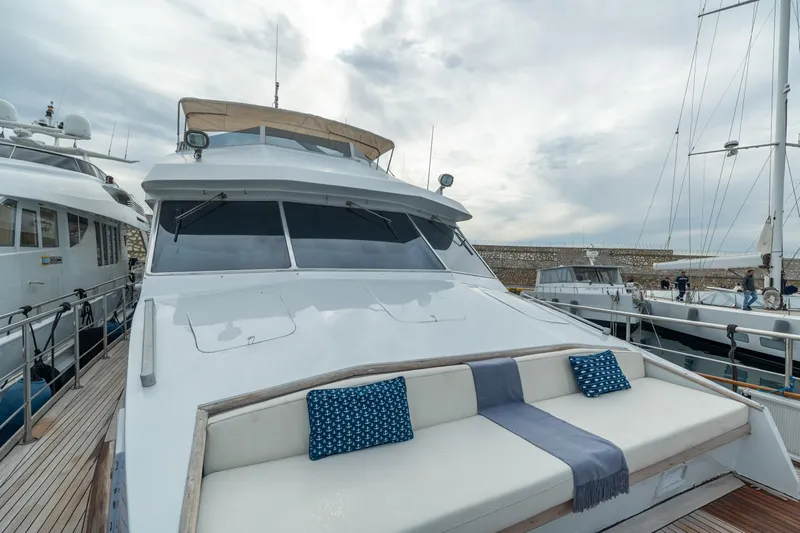 Anonymous Yacht Photos Pics Luxury yacht by Hellenic Shipyards, 1981 model, docked with elegant seating area.