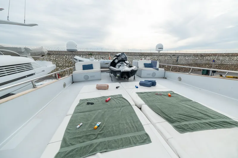 Anonymous Yacht Photos Pics Luxurious 1981 Hellenic Shipyards custom yacht deck with sunbathing area and jet ski.