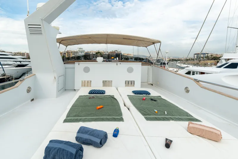 Anonymous Yacht Photos Pics Sun deck of 1981 Hellenic Shipyards custom yacht with loungers and towels.