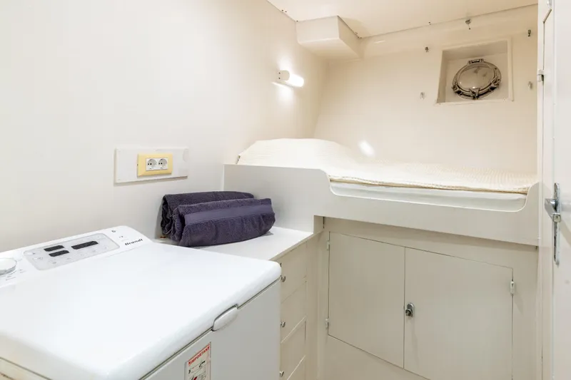 Anonymous Yacht Photos Pics Compact ship cabin with bed, washing machine, and storage, built by Hellenic Shipyards in 1981.