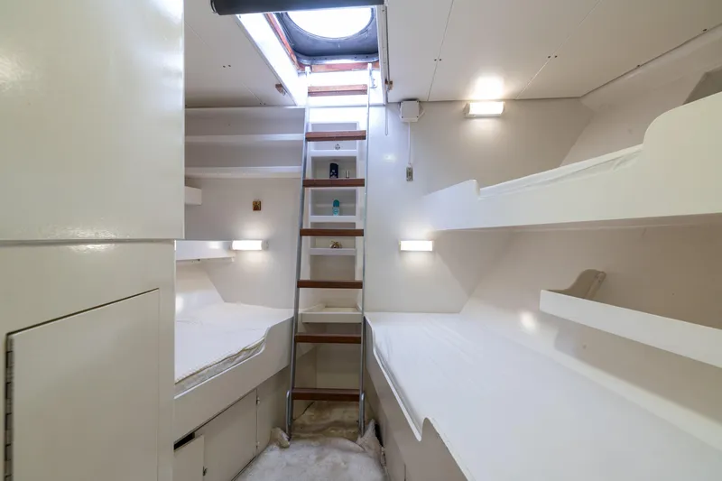 Anonymous Yacht Photos Pics Compact ship cabin with bunk beds, ladder, and skylight, Hellenic Shipyards Custom 1981 model.