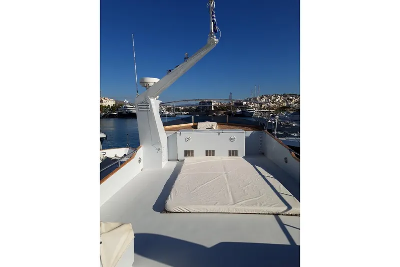 Anonymous Yacht Photos Pics Deck view of 1981 Hellenic Shipyards Custom yacht in a sunny marina.