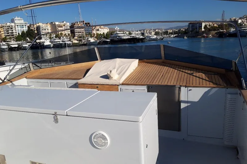 Anonymous Yacht Photos Pics Deck view of 1981 Hellenic Shipyards custom yacht in marina setting.