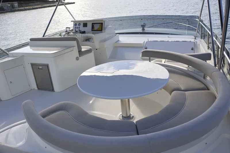  Yacht Photos Pics Luxurious 2004 Ferretti Yachts 680 flybridge with elegant seating and navigation controls.