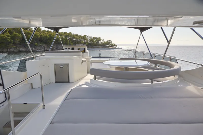  Yacht Photos Pics Luxurious 2004 Ferretti Yachts 680 flybridge with elegant seating and ocean view.