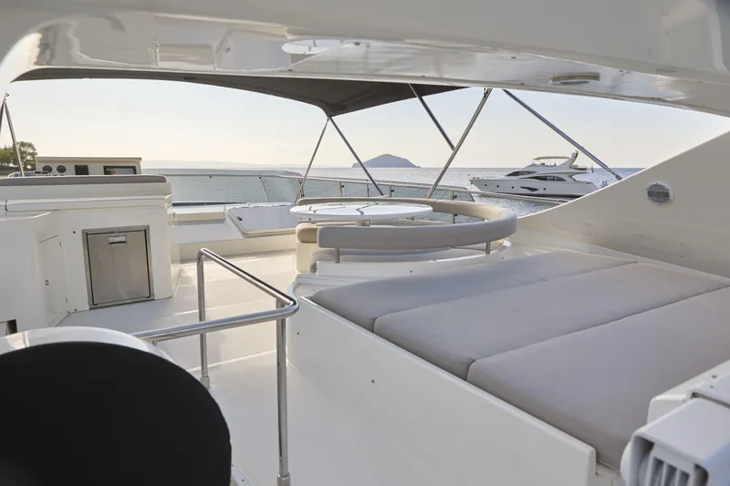  Yacht Photos Pics Luxurious 2004 Ferretti Yachts 680 flybridge with ocean view and elegant seating area.