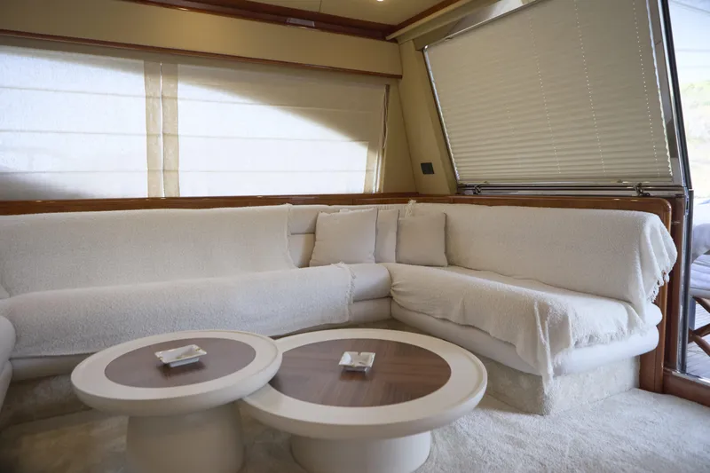  Yacht Photos Pics Luxurious interior of 2004 Ferretti Yachts 680 with plush white seating and elegant tables.
