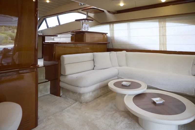  Yacht Photos Pics Luxurious interior of 2004 Ferretti Yachts 680 with plush seating and elegant wood finishes.