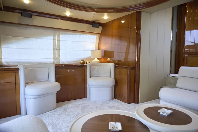  Yacht Photos Pics Luxurious interior of 2004 Ferretti Yachts 680 with elegant seating and wooden accents.