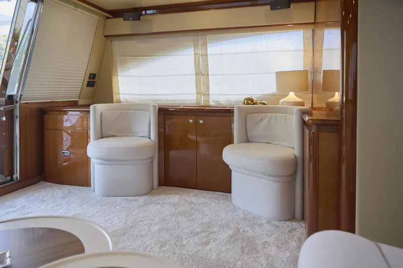  Yacht Photos Pics Luxurious interior of 2004 Ferretti Yachts 680 with elegant seating and soft lighting.