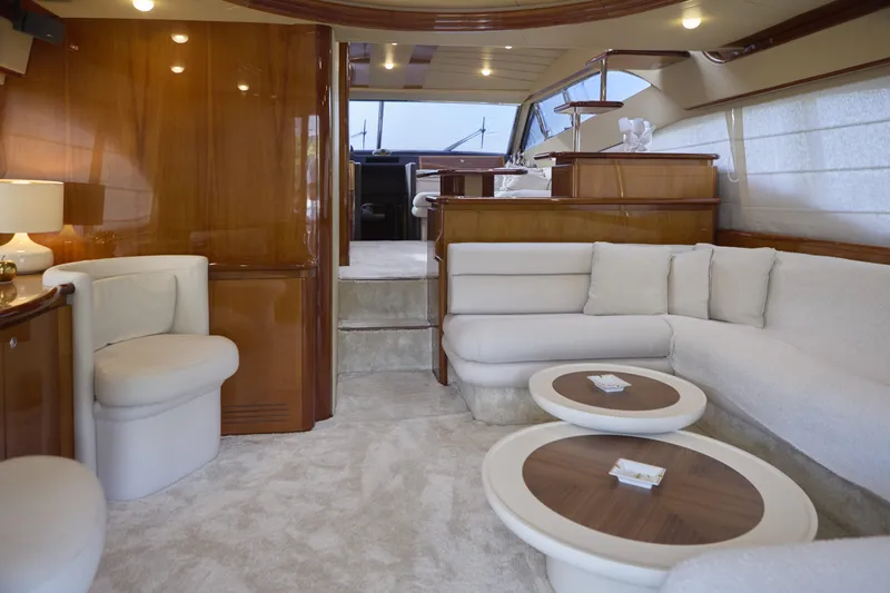  Yacht Photos Pics Luxurious interior of 2004 Ferretti Yachts 680 with elegant seating and wooden accents.